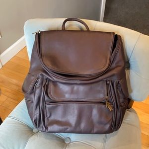 Beautiful genuine soft leather backpack are used as a camera case